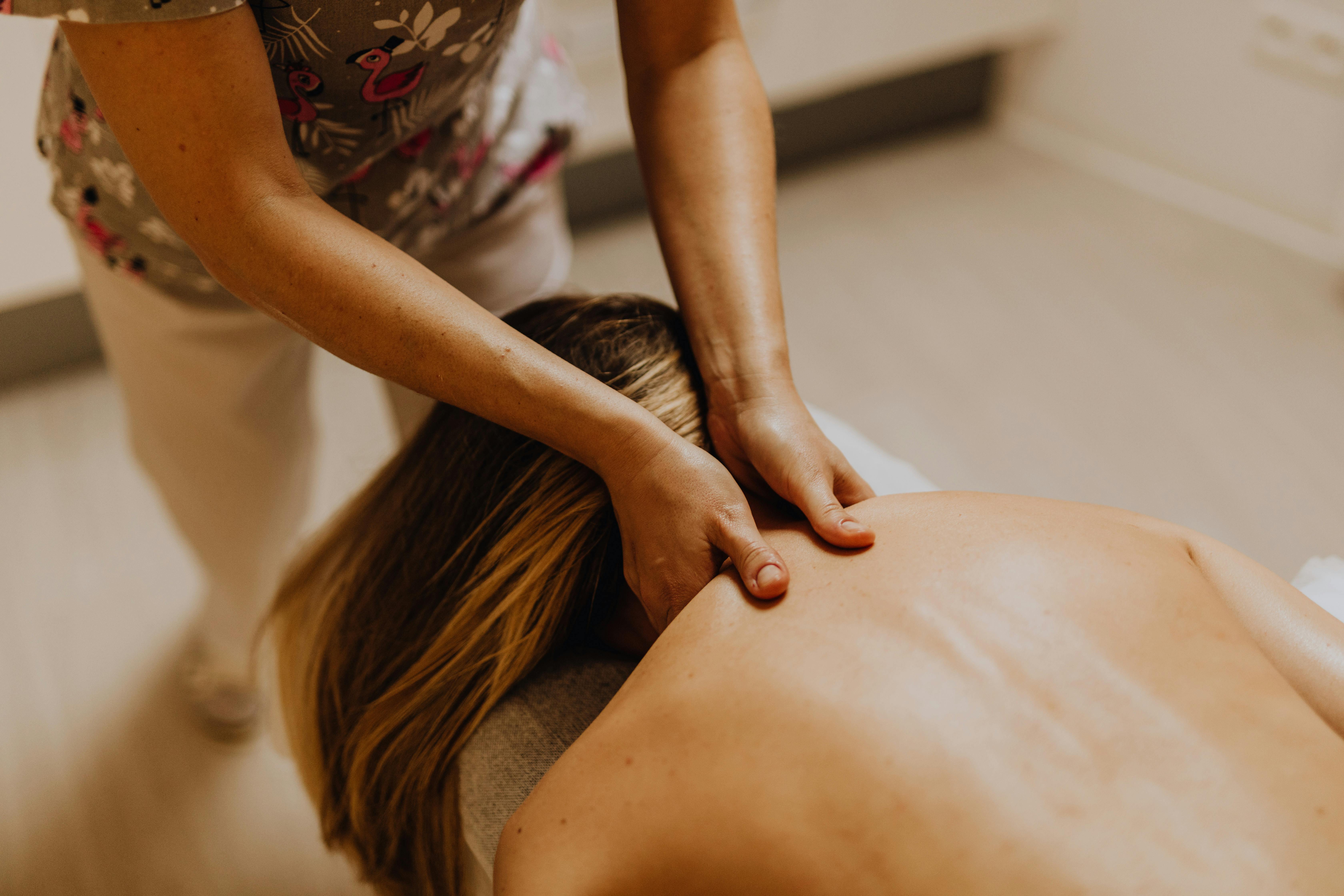 Massage therapist working on a patient